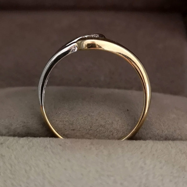0.10 Round Brilliant Cut Diamond Twist Ring in White & Yellow Gold